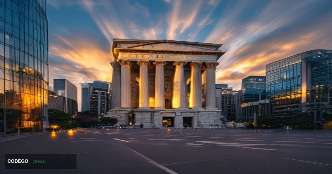 A dramatic editorial photograph capturing the imposing neoclassical facade of the <a href="https://www.boj.or.jp/en/" target=