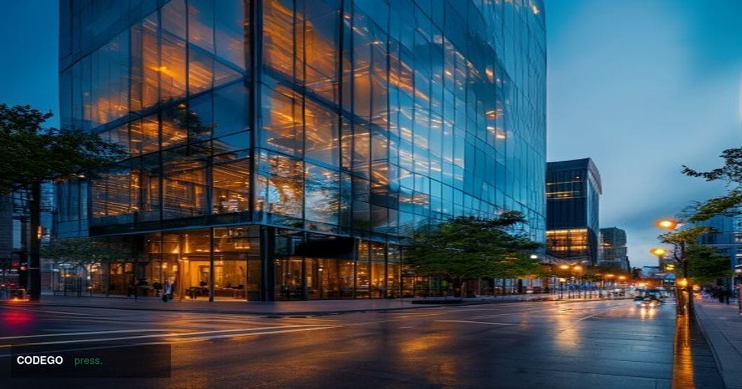 A dramatic cinematic photograph of the iconic Coinbase headquarters building in San Francisco's SOMA district, with its disti
