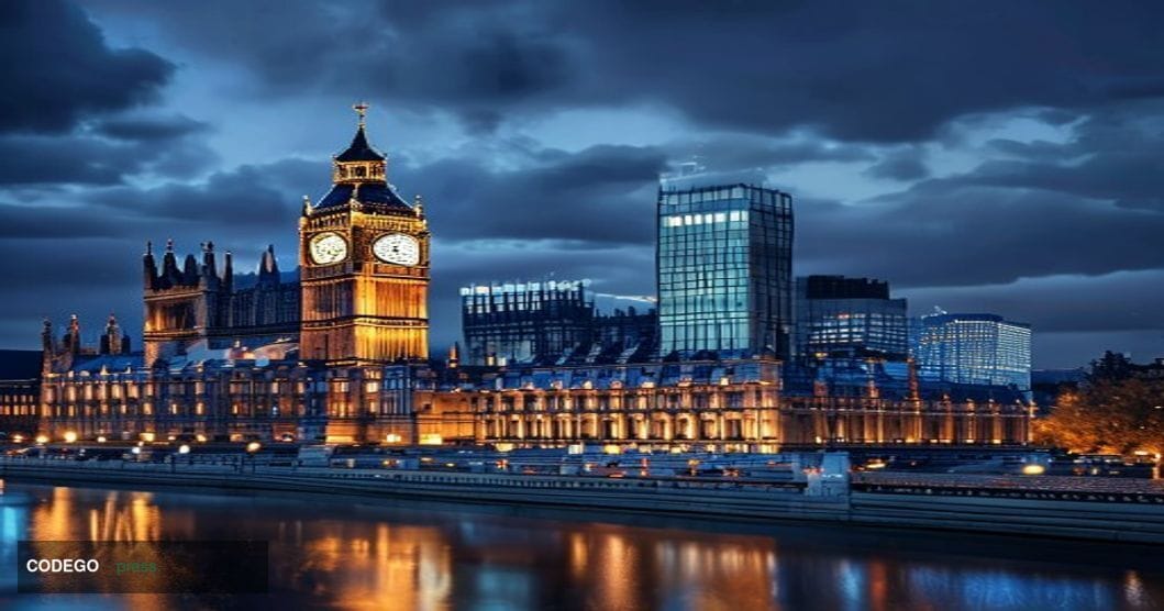 A cinematic editorial photograph showing the iconic Palace of Westminster and Big Ben illuminated against a dramatic twilight