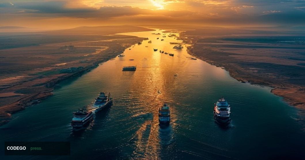 A dramatic aerial photograph of the Strait of Hormuz at golden hour, showing the narrow waterway between Iran and Oman with m