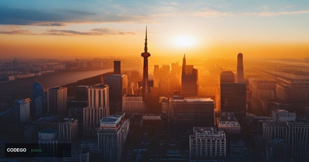 A dramatic aerial view of Beijing's Central Business District at golden hour, showcasing the China World Trade Center and oth