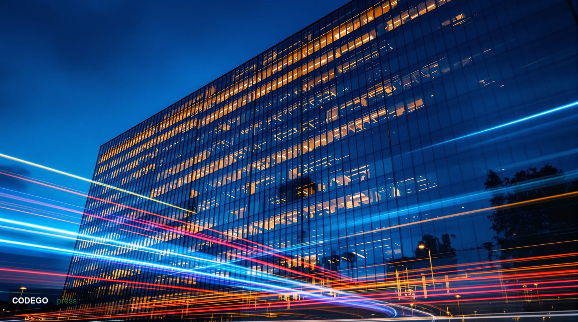 A dramatic wide-angle shot of a modern glass corporate headquarters building at dusk, with warm amber light emanating from of