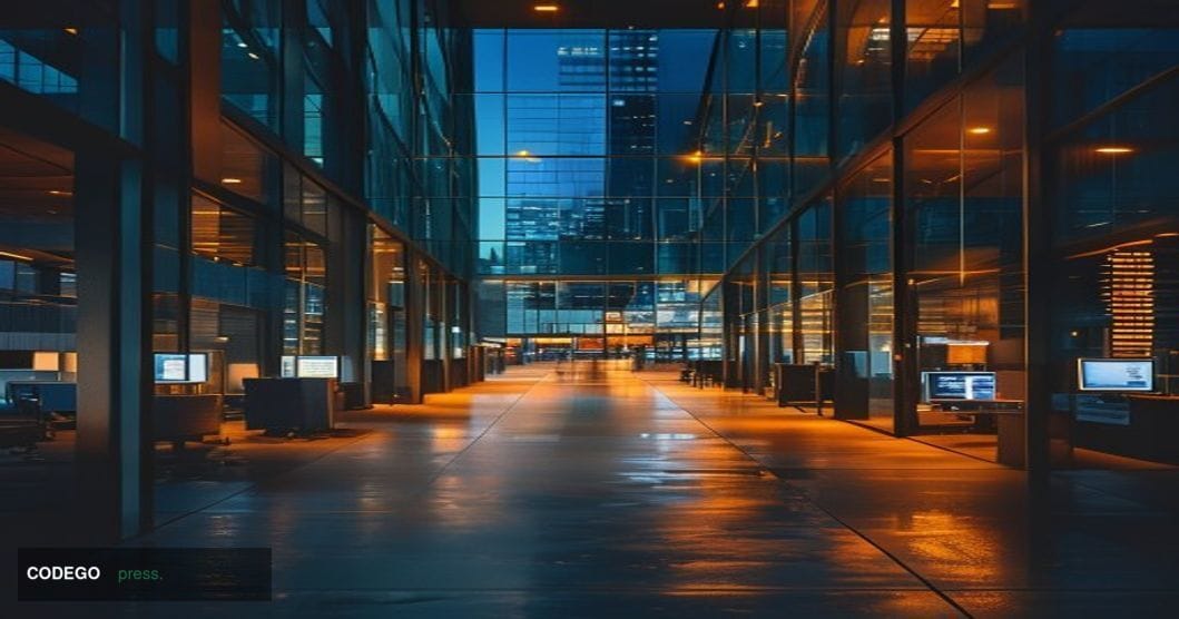 A photorealistic editorial photograph of a modern glass office building at twilight with empty floors visible through floor-t
