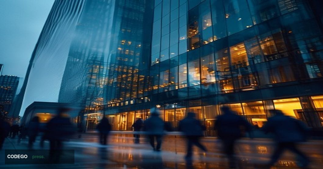 A dramatic editorial photograph of Wise's modern London headquarters building exterior, shot from a low angle against an over
