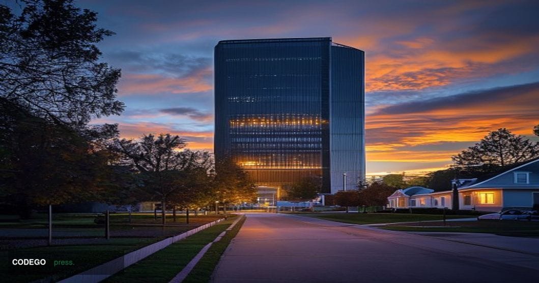 A photorealistic editorial photograph shot at dusk from a low angle looking up at a massive, industrial AI data center facili