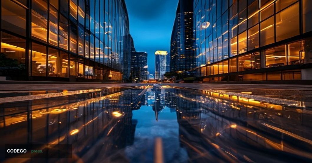 A photorealistic editorial photograph shot from a low angle at dusk, looking up at the glass-and-steel facade of a modern Sou