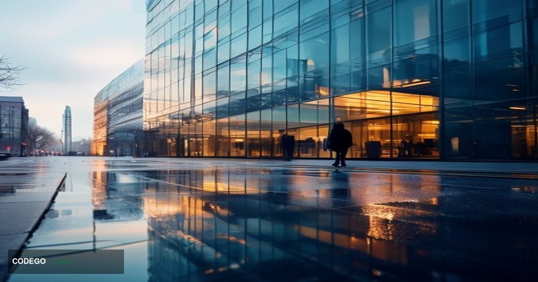 A cinematic editorial photograph of a modern glass-and-steel office building in central London on an overcast morning, identi