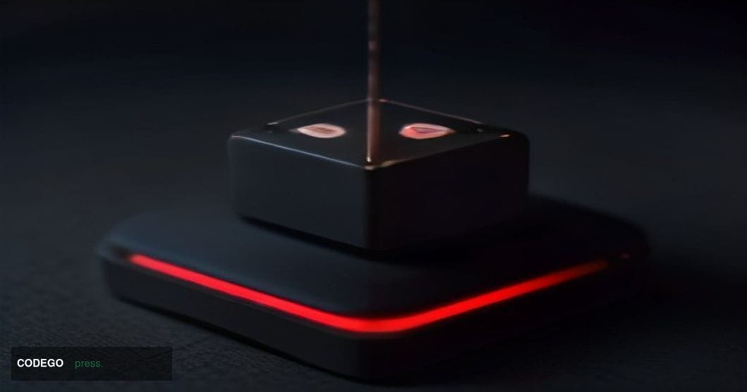 A dramatic close-up cinematic editorial photograph of a Coldcard hardware wallet device — the small black rectangular device 