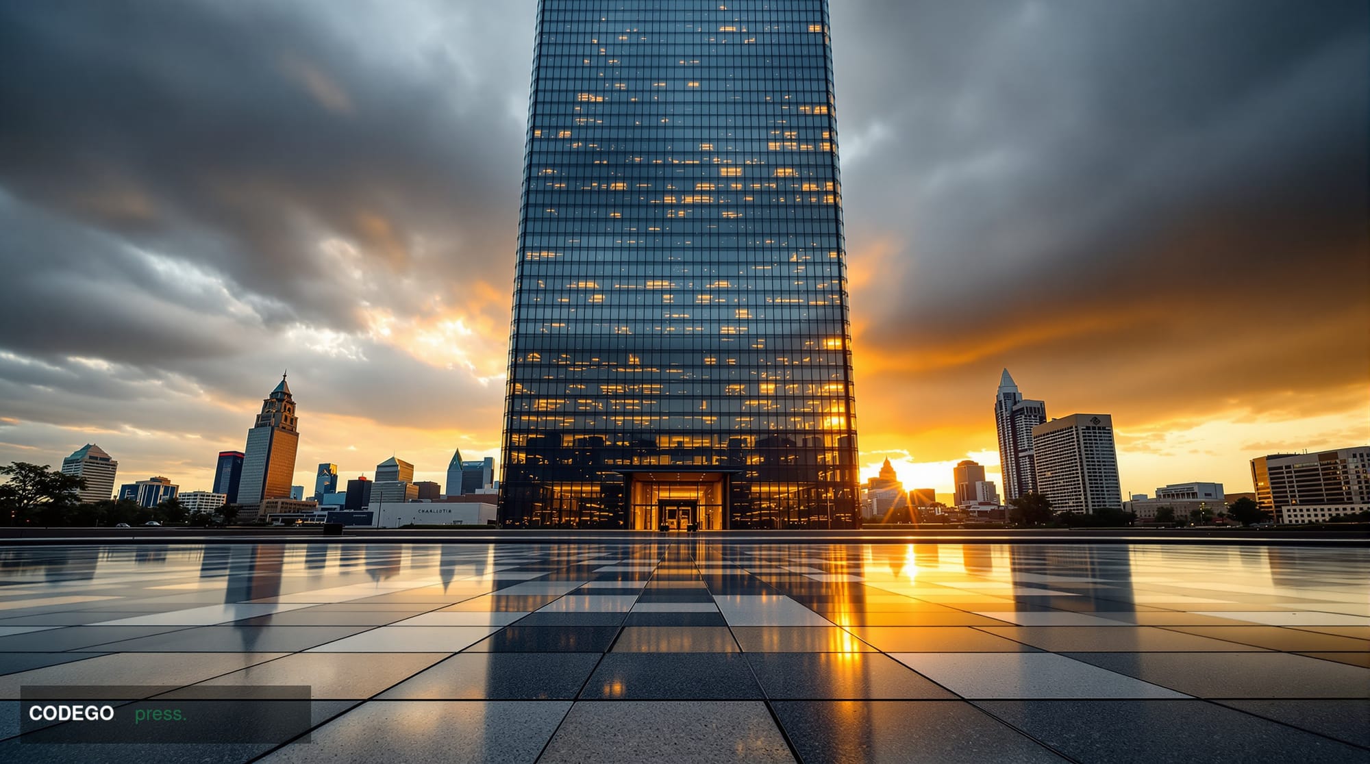 A dramatic low-angle cinematic shot of a monumental glass-and-steel corporate banking tower in Charlotte, North Carolina, the