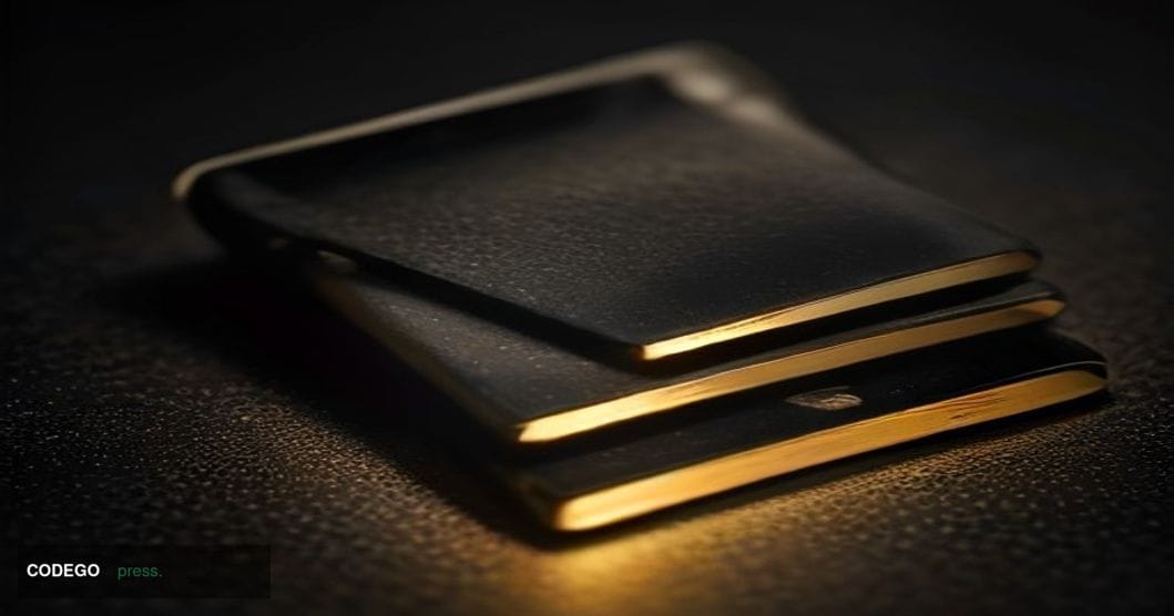A dramatic close-up editorial photograph of a Coldcard hardware wallet device resting on a dark matte surface, cracked down t