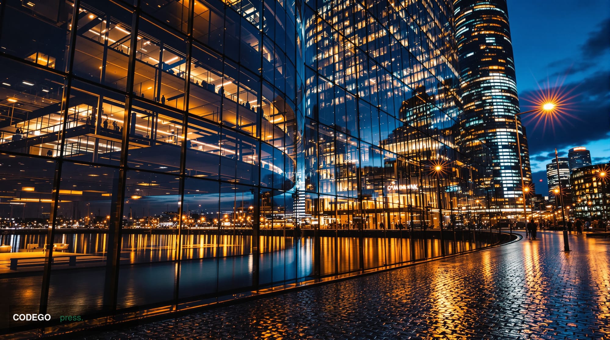 A dramatic wide-angle shot of the Financial Conduct Authority's Canary Wharf headquarters in London — the sleek glass tower r