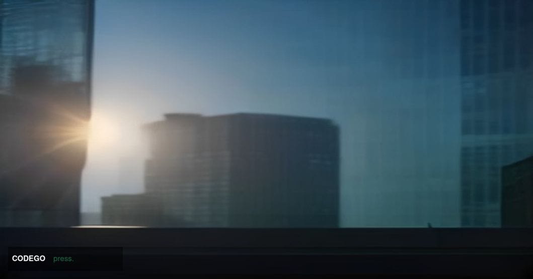 A cinematic editorial photograph shot from a low angle looking up at a grand Alaskan civic building exterior at golden hour, 