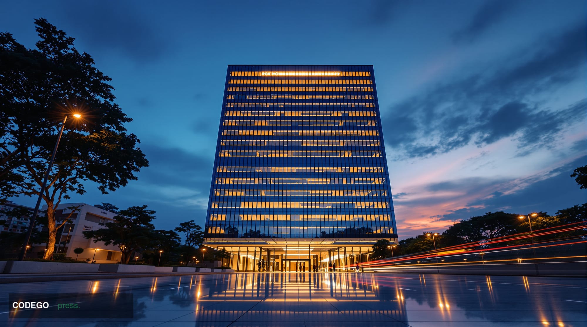 A cinematic editorial photograph set at dusk in Bengaluru's modern tech corridor, with a sleek glass-and-steel corporate offi