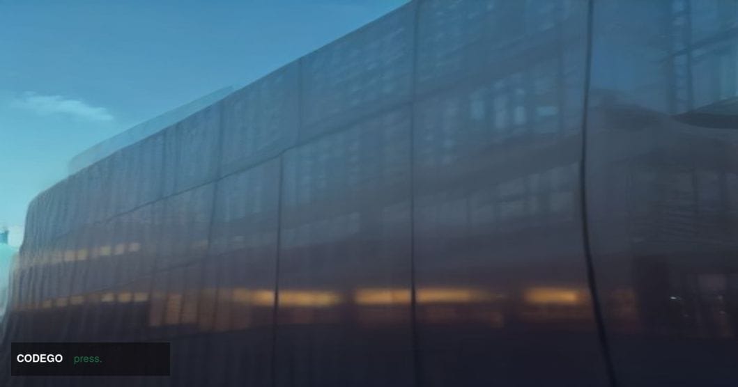 A cinematic editorial photograph shot from a low angle looking up at a towering modern glass-and-steel corporate campus build