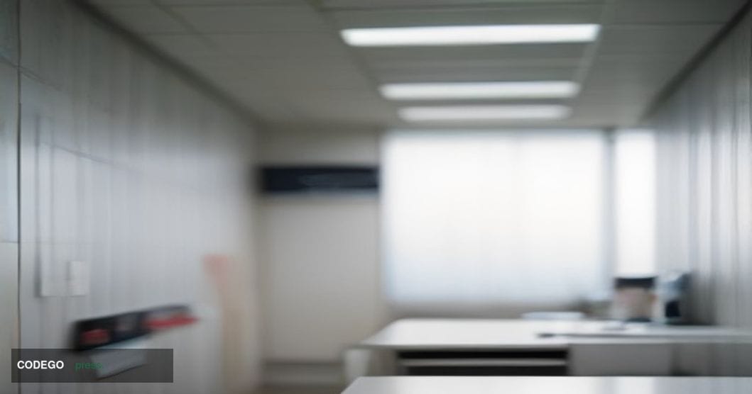 A photorealistic cinematic editorial photograph taken inside a modern American hospital reception desk area, shot from a low 