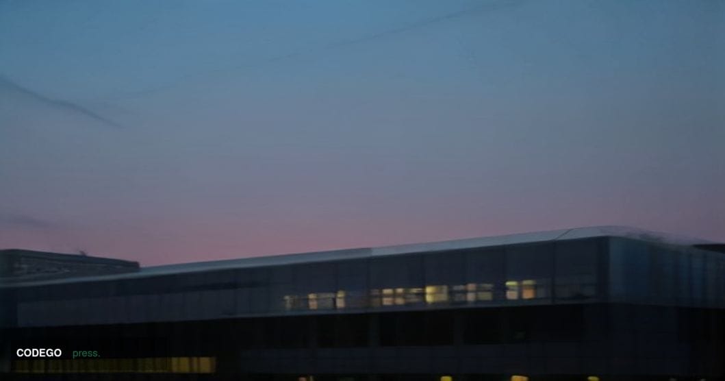 A cinematic editorial photograph of the Financial Conduct Authority's London headquarters building exterior in the City of Lo