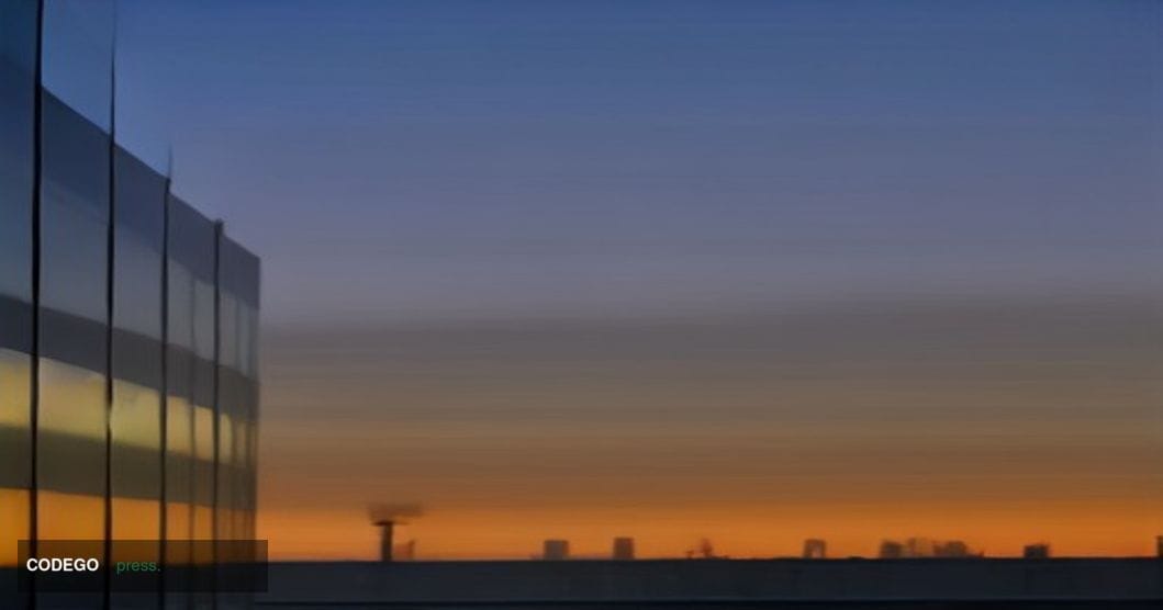 A sweeping low-angle dusk shot of Visa's Foster City, California corporate campus — a sleek ensemble of glass-and-steel build