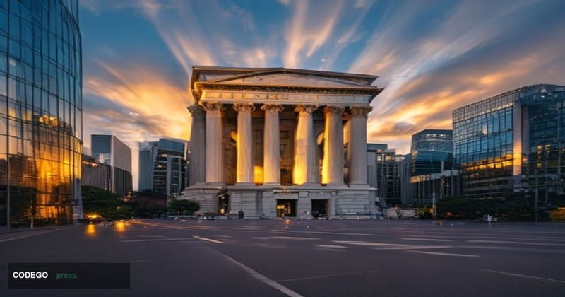 A dramatic editorial photograph capturing the imposing neoclassical facade of the <a href="https://www.boj.or.jp/en/" target=