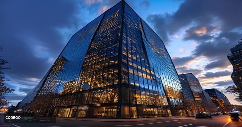 A cinematic editorial photograph of Standard Chartered's distinctive headquarters building in London's financial district, sh