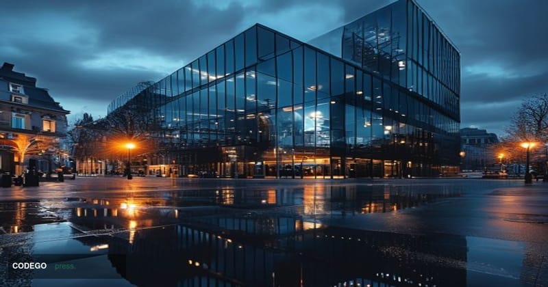 A dramatic photorealistic editorial photograph showing Wise's London headquarters building at dusk, with the company's distin