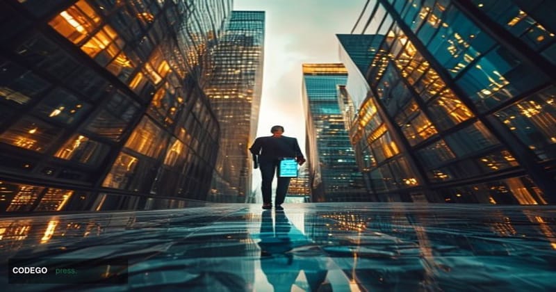 A cinematic editorial photograph shot at a dramatic low angle looking up at the glass-and-steel facades of two converging fin