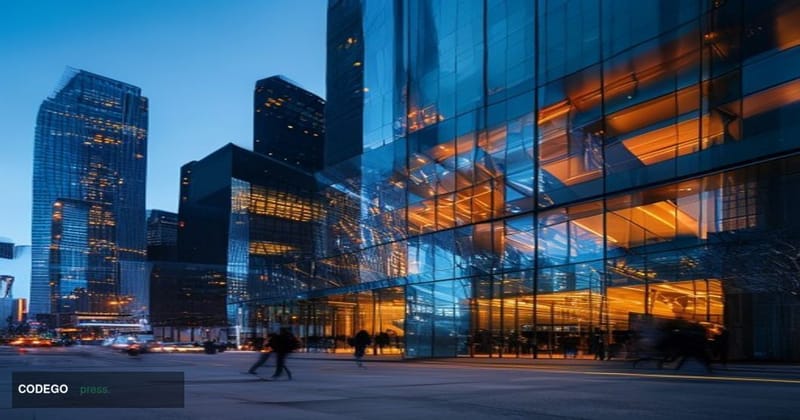A cinematic editorial photograph of the Coinbase San Francisco headquarters building exterior, shot from a low angle at dusk 