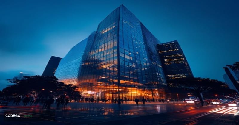 Exterior shot of Coinbase's San Francisco corporate headquarters building photographed at dusk from a low-angle perspective, 