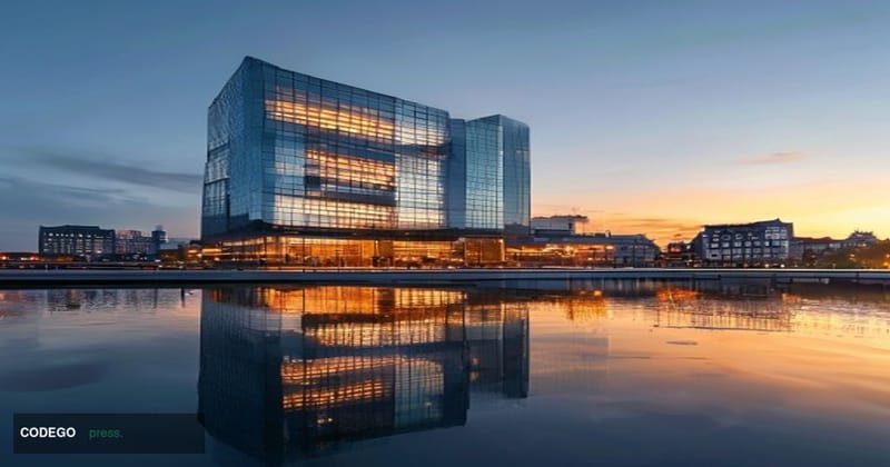 Exterior façade of the European Central Bank headquarters in Frankfurt, Germany, photographed at dawn with warm amber morning