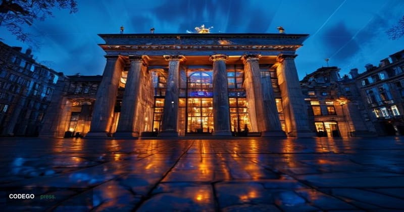 A grand neoclassical European Parliament building in Brussels photographed at dusk, the facade dramatically lit with warm amb