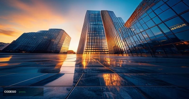 A dramatic cinematic editorial photograph taken at street level looking upward at a towering modern glass-and-steel financial