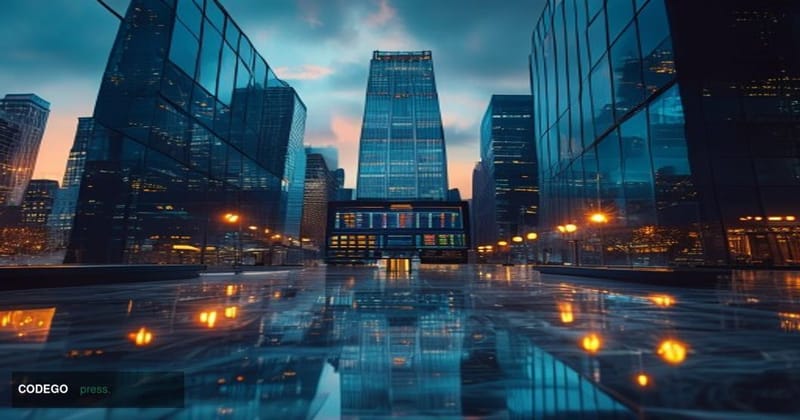 A cinematic editorial photograph centered on a polished glass-and-steel financial district office tower at dusk, with the Gra