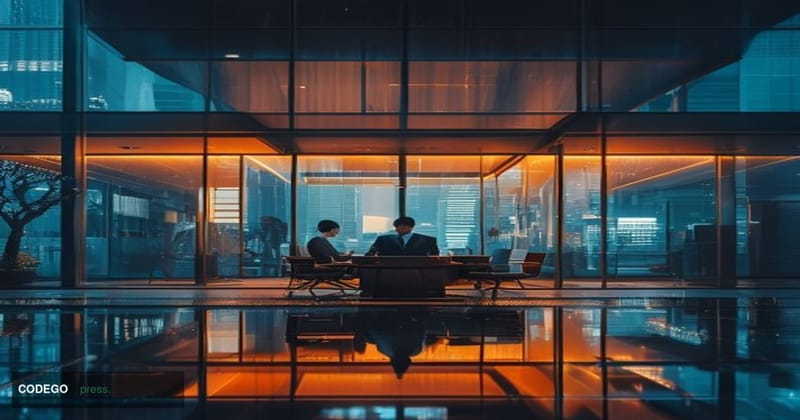A cinematic editorial photograph set in a modern Tokyo financial district at dusk, with the warm amber glow of neon signage a