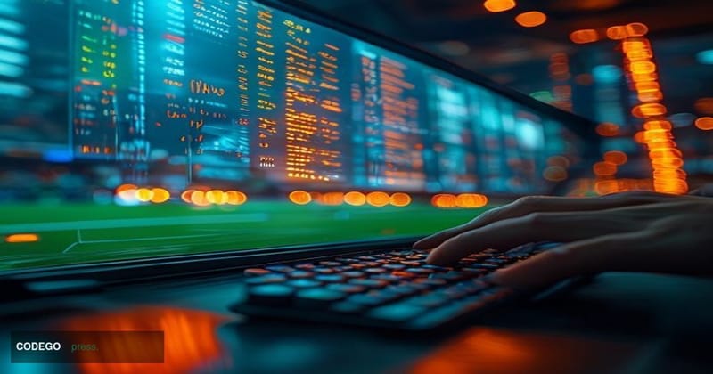A cinematic editorial photograph centered on a large digital trading terminal screen displaying a FIFA World Cup prediction m