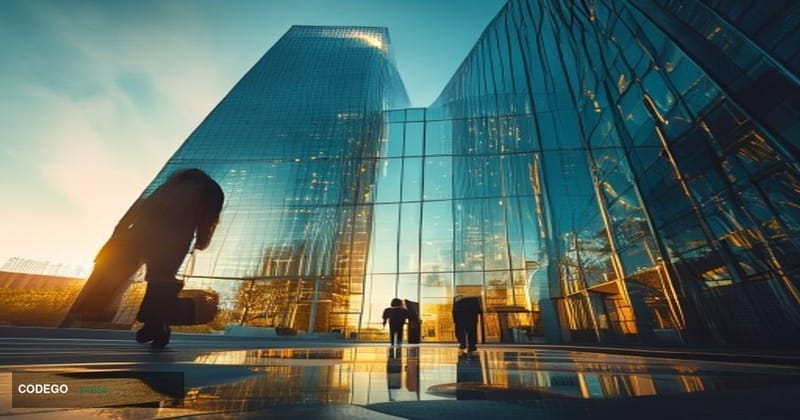 A cinematic editorial photograph taken at ground level looking up at the Coinbase headquarters building exterior in San Franc