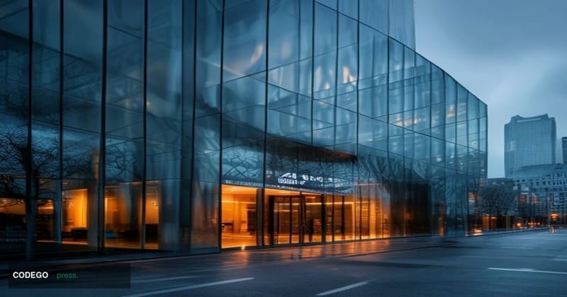 A cinematic editorial photograph of a sleek, modern fintech headquarters in London's financial district, with the Thames visi