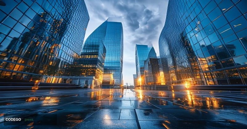 A cinematic editorial photograph taken from a low-angle perspective looking up at the glass-and-steel facades of four adjacen