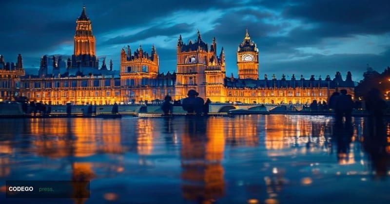 A dramatic cinematic editorial photograph of the UK Houses of Parliament at Westminster, shot from across the River Thames at