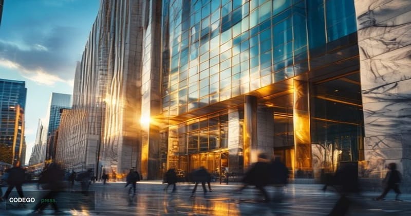 A photorealistic editorial photograph shot from a low-angle perspective looking up at a sleek modern bank branch facade with 