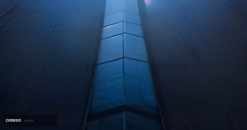 A dramatic cinematic editorial photograph shot from a low angle looking up at the sleek glass-and-steel facade of an Ethereum