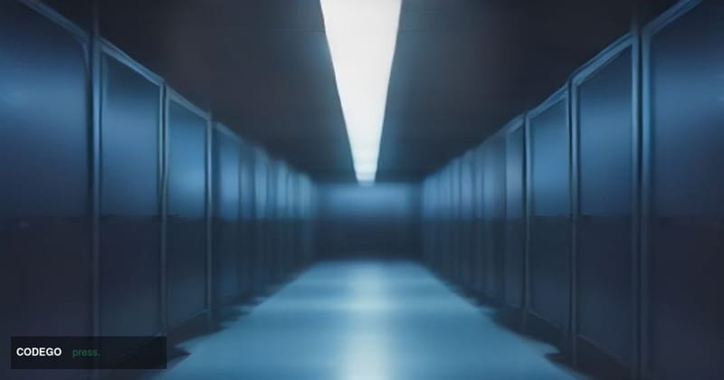 A dramatic cinematic editorial photograph set in a dimly lit modern server room corridor, shot from a low angle looking upwar
