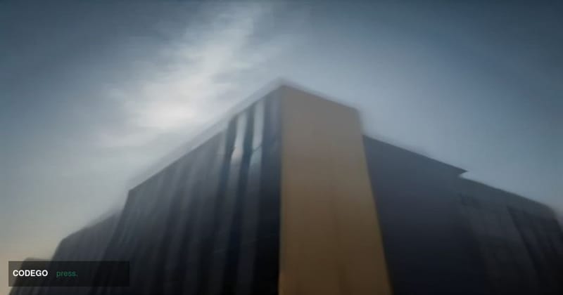 A cinematic editorial photograph shot from a low-angle perspective looking up at a sleek, modernist glass-and-steel financial