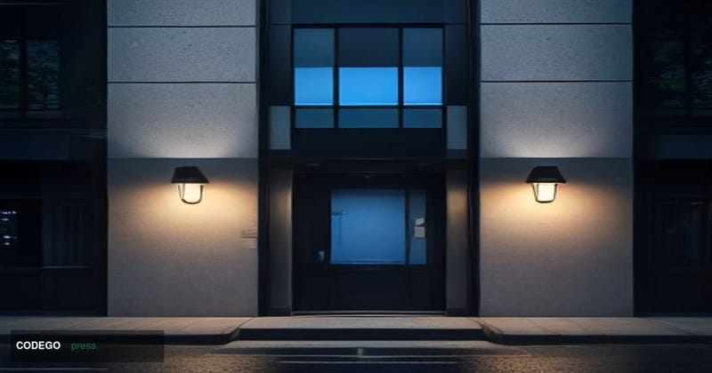 A dramatic cinematic editorial photograph of a mid-sized American bank branch exterior at dusk, its glass facade darkened and