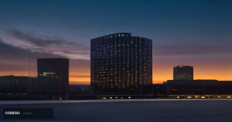 A cinematic editorial photograph of a sleek modern financial technology campus exterior at dusk in Denver, Colorado, with the