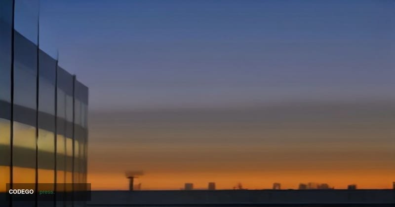 A sweeping low-angle dusk shot of Visa's Foster City, California corporate campus — a sleek ensemble of glass-and-steel build